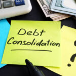 Debt consolidation written by hand and money.